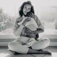 Anna Malaika Tubbs, author of The Three Mothers, holds her infant son, Michael Malakai Tubbs, Jr., in her home.