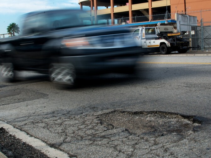 A pothole on Aviation Boulevard near LAX. The city is working on a backlog of reimbursements for car damage because of the numerous potholes that go unfixed.