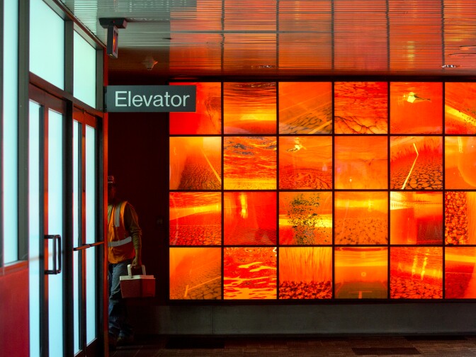 Luciana Abait's Aquarium and Underwater series is on display inside the Virgin America ticketing area in terminal 3 at Los Angeles International Airport.
