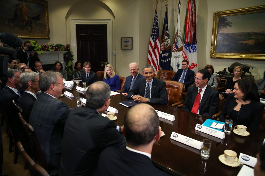 U.S. President Barack Obama (3R) and Vice President Joe Biden meet with executives from leading technology companies, including Apple, Twitter, and Google in the Roosevelt Room of the White House on December 17, 2013 in Washington, DC. The White House said the meeting focused on efforts to repair administration's troubled HealthCare.gov website. 