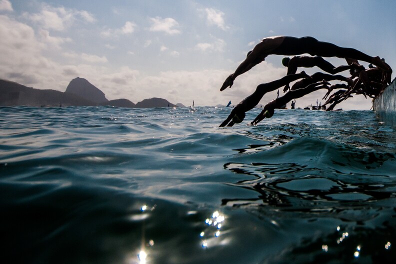 RIO DE JANEIRO, BRAZIL - AUGUST 22: Competitors jump into the waters of Copacabana beach as they take part in the Marathon Swimming Challenge - Aquece Rio Test Event for Rio 2016 Olympics on August 22, 2015 in Rio de Janeiro, Brazil.  (Photo by Buda Mendes/Getty Images)