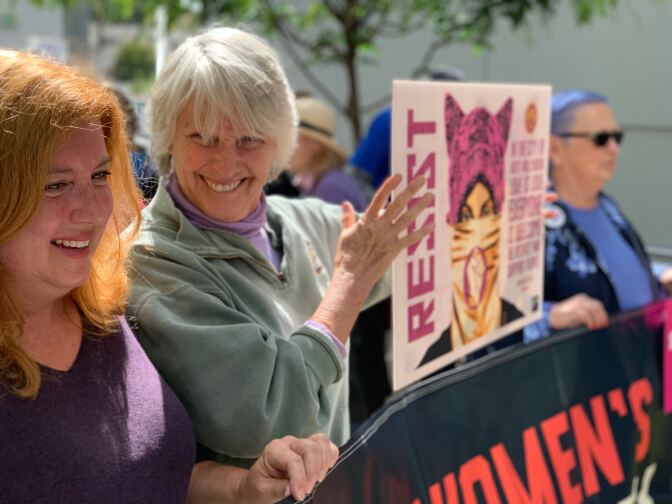 Protesters in West Hollywood held signs and cheered during the #StopTheBans rally. 