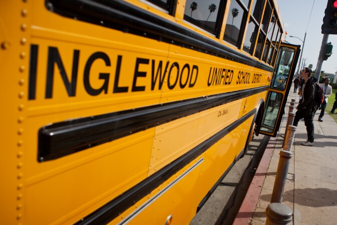 A student boards a bus maintained by the Inglewood Unified School District on February 28, 2012.