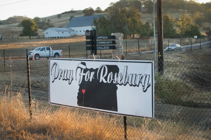 A sign sits along the road to Umpqua Community College on October 2, 2015 in Roseburg, Oregon.  Yesterday 10 people were killed and another seven were wounded on the campus when 26-year-old Chris Harper Mercer went on a shooting rampage. 