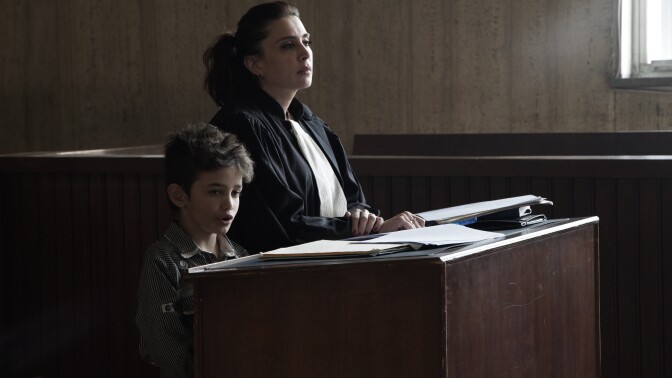 <em></em>In <em>Capernaum</em>, Zain (Zain Al Rafeea) takes the stand to sue his parents. In a cameo appearance, his lawyer is played by the film's director, Nadine Labaki.