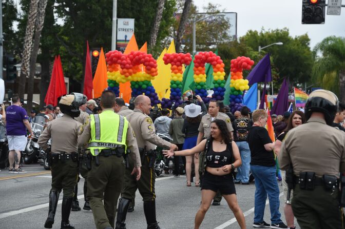 Police stand by to provide security for the 2016 Gay Pride Parade June 12, 2016 in Los Angeles, California.