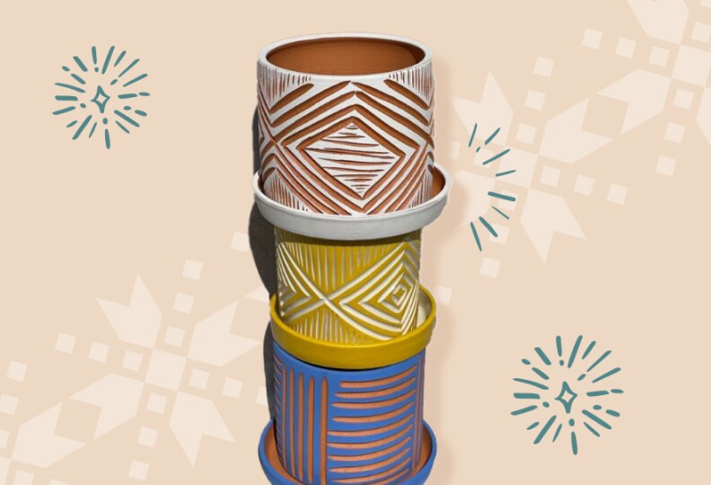 Three planters — blue, yellow and terracotta — with deep etchings are stacked