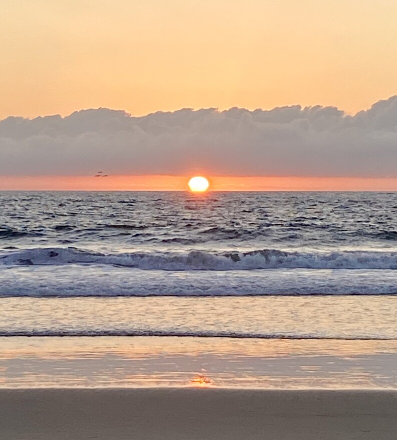 The sun sets into the sea