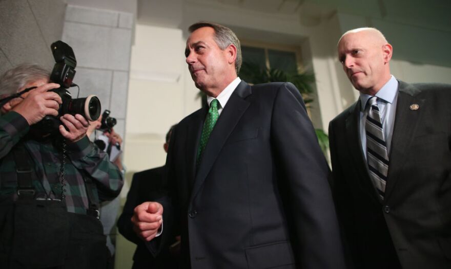 Speaker of the House John Boehner (R-OH) (C) leaves the second House Republican Caucus meeting of the day with House Ways and Means Committee Chairman Dave Camp (R-MI) (R) during a rare New Year's Day session  January 1, 2013 in Washington, DC. 
