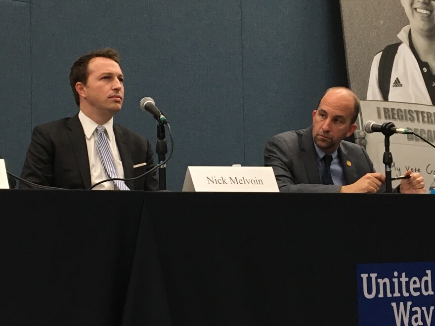 L.A. Unified School Board candidate Nick Melvoin (left) and incumbent board president Steve Zimmer listen during a recent candidate forum.