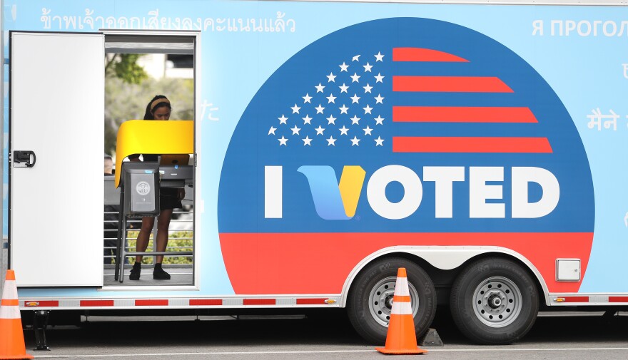 UNIVERSAL CITY, CALIFORNIA - FEBRUARY 27: A voter prepares her ballot during early voting for the California presidential primary election at a new L.A. County ‘Mobile Vote Center’ outside Universal Studios Hollywood on February 27, 2020 in Universal City, California. Los Angeles County and 14 other counties in California have transitioned from traditional polling places to ‘vote centers’ which allow residents the freedom to vote at any voting center in their county. California is one of 14 states participating in the Super Tuesday vote on March 3. (Photo by Mario Tama/Getty Images)