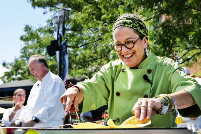 Susan Feniger, a chef from the Champions' Round of the most recent season of Top Chef Masters, smiles while making carne asada tacos during day six of the 2010 U.S. Open at the USTA Billie Jean King National Tennis Center on September 4, 2010 in the Flushing neighborhood of the Queens borough of New York City.  