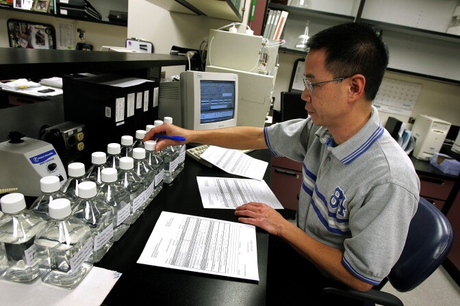 Quality control technician Frank Pantaleon works at his lab station on part of the development of the synthetic blood substitute PolyHeme at Northfield Labs in Mount Prospect, Illinois. 