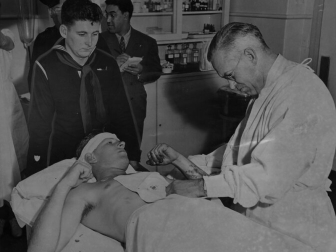 Donald Jackson, a 20-year-old sailor, who was slashed in the abdomen in a riot between servicemen and zoot-suiters on Thurday, June 3, 1943, is shown being treated in the hospital. 