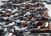A photo released by LAPD shows a cache of over 1,000 firearms seized from a mansion in the Holmby Hills neighborhood of Los Angeles on Thursday, May 9, 2019. (Courtesy of LAPD)
