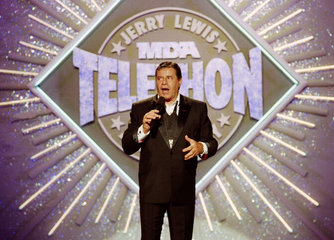 In this Sept. 2, 1990 file photo, entertainer Jerry Lewis makes his opening remarks at the 25th Anniversary of the Jerry Lewis MDA Labor Day Telethon fundraiser in Los Angeles.