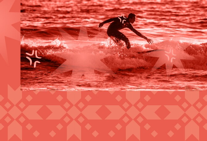 A man surfing in the ocean