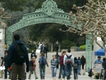 Students walk near Sather Gate on the University of California at Berkeley campus.