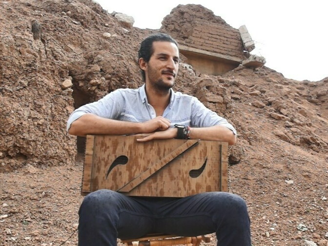 Mokdad with the instrument he invented, named "Adad."