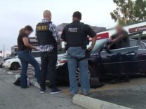 This screen capture from a video ICE released Friday, Aug. 14, 2015 shows a scene from Operation No Safe Haven II, which ended in the arrests of 7 fugitives in Southern California and 50 nationwide.