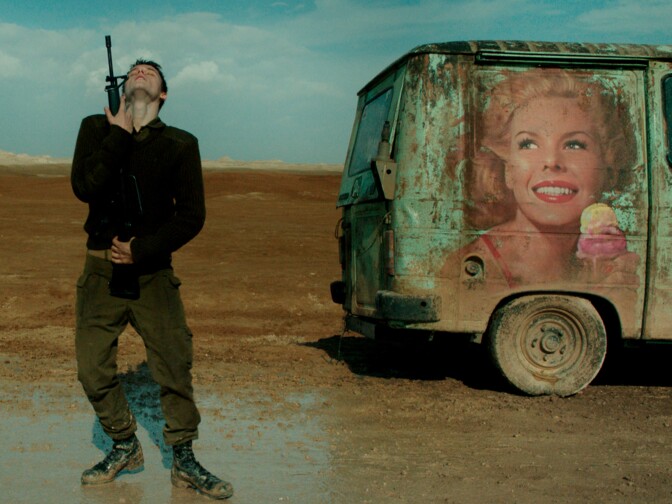 At a lonely checkpoint, an Israeli  soldier (Itay Exlroad) dances with his weapon in <em>Foxtrot</em>.
