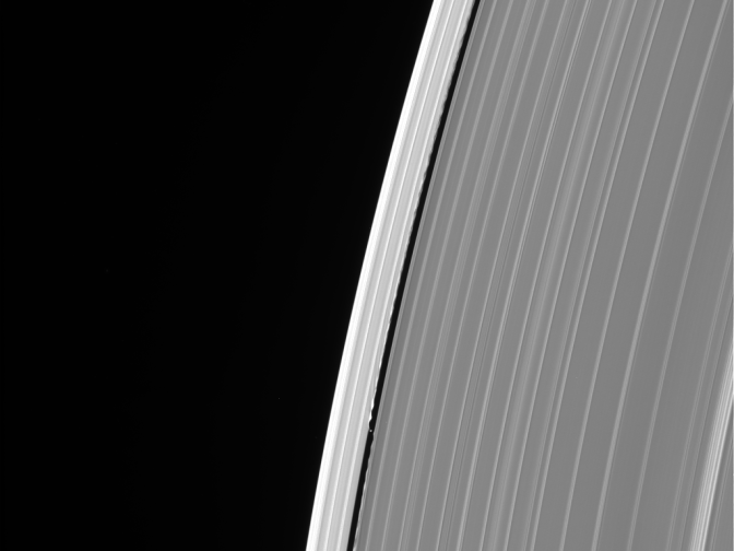 This image of Saturn's outer A ring features the small moon Daphnis and the waves it raises in the edges of the Keeler Gap. The image was taken by NASA's Cassini spacecraft on Sept. 13, 2017. It is among the last images Cassini sent back to Earth.