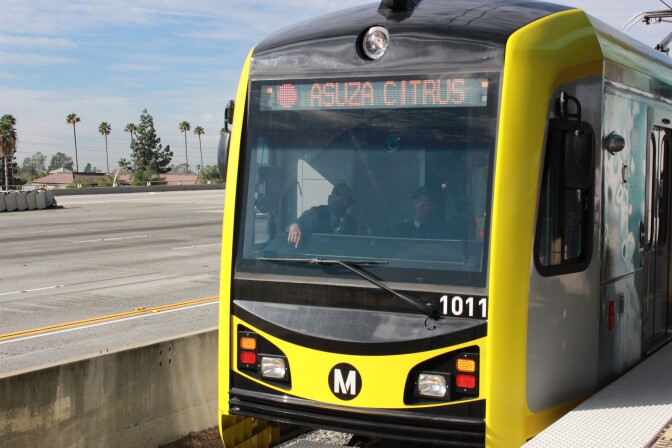 File: A new light rail vehicle for the Gold Line Foothill Extension leaves Sierra Madre Villa station headed for Azusa, which is spelled wrong on the train. 