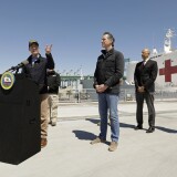 LOS ANGELES, CA - MARCH 27: California Governor Gavin Newsom listens as Los Angeles Mayor Eric Garcetti speaks in front of the hospital ship USNS Mercy that arrived into the Port of Los Angeles on Friday, March 27, 2020, to provide relief for Southland hospitals overwhelmed by the coronavirus pandemic. (Photo by Carolyn Cole-Pool/Getty Images)