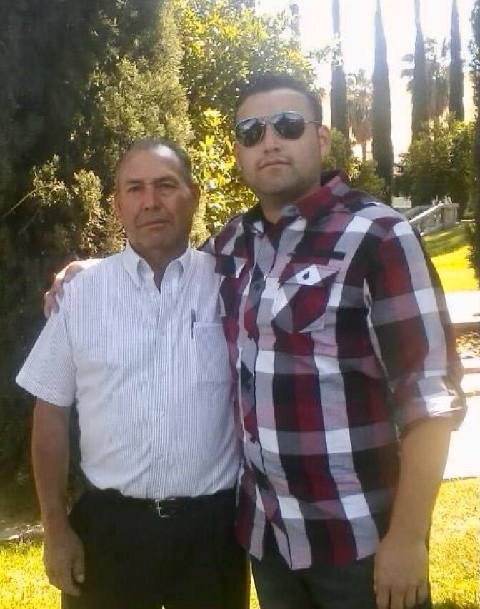 David Ordaz, Sr. stands next to son David Ordaz, Jr. 