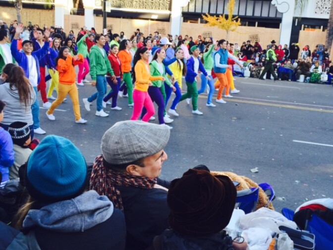 File: Attendees watch the 2015 Rose Parade from the roadside on January 1 in Pasadena.