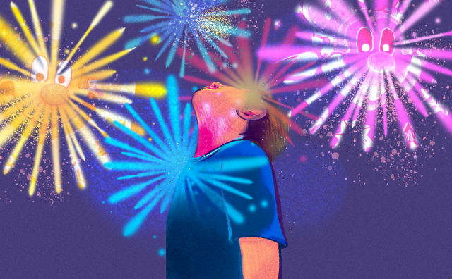 A kid looking up at the night sky to watch Disneyland fireworks.