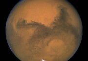 This image released August 27, 2003 captured by NASA's Hubble Space Telescope shows a close-up of the red planet Mars when it was just 34,648,840 miles (55,760,220 km) away. This color image was assembled from a series of exposures taken between 6:20 p.m. and 7:12 p.m. EDT August 26, 2003 with Hubble's Wide Field and Planetary Camera 2. The picture was taken just 11 hours before the planet made its closest approach to Earth in 60,000 years. Many small, dark, circular impact craters can be seen, attesting to the Hubble telescope's ability to reveal fine detail on the planet's surface.