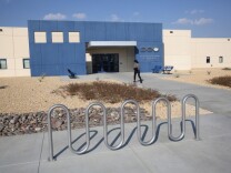 A family member walks into the Adelanto Detention Facility on November 15, 2013 in Adelanto, California. 