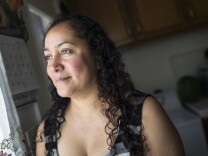 Xochitl Camberos studies every morning in her Inglewood home. Camberos, who received a nursing degree in Mexico, is working to get one in the United States. Camberos is one of many immigrants without legal status in California taking steps to apply for professional licenses under a new state law that takes final effect soon.