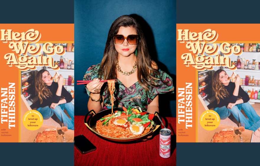 A collage of three different ideas. On both the far right and left sides are identical pictures of the cookbook cover titled "Here We Go Again" with the name Tiffani Thiessen on the left-hand side of the cover. The middle image is a color photograph of Thiessen with long brown hair in a multi-colored dress and oversized lensed sunglasses, seated at a table holding a pair of chopsticks over a large plate of noodles containing orange sauce. Next to the sauce is an aluminum canned beverage with a straw.