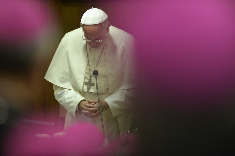 Pope Francis prays during the 68th General Assembly of the Italian Episcopal Conference on May 18, 2015 at the Vatican.   AFP PHOTO / ANDREAS SOLARO        (Photo credit should read ANDREAS SOLARO/AFP/Getty Images)