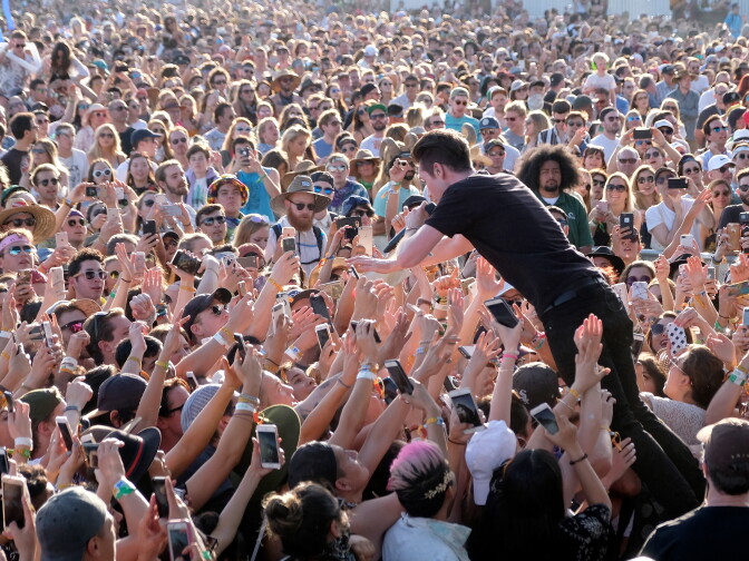 INDIO, CA - APRIL 15:  Musician Dan Smith of Bastille crowd surfs at the Outdoor Stage during day 2 of the Coachella Valley Music And Arts Festival (Weekend 1) at the Empire Polo Club on April 15, 2017 in Indio, California.  (Photo by Frazer Harrison/Getty Images for Coachella)