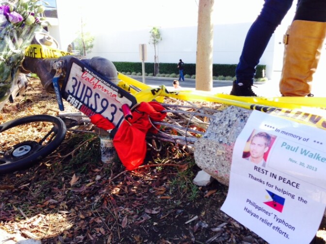 A flier at the crash scene thanks Paul Walker for his charity's work on behalf of typhoon victims in the Philippines. 