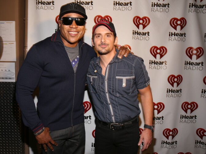 LAS VEGAS, NV - SEPTEMBER 22:  Actor/rapper LL Cool J (L) and recording artist Brad Paisley appear backstage during the 2012 iHeartRadio Music Festival at the MGM Grand Garden Arena on September 22, 2012 in Las Vegas, Nevada.  (Photo by Christopher Polk/Getty Images for Clear Channel)