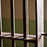 Bars of an open prison cell 