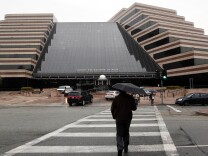 Pedestrians cross a street in front of the Sony Pictures Entertainment headquarters in Culver City, Calif. The FBI has confirmed it is investigating a recent hacking attack at Sony Pictures Entertainment, which caused major internal computer problems at the film studio. It was followed by a threatening mass email to Sony employees, purportedly from the hackers. (AP Photo/Nick Ut)