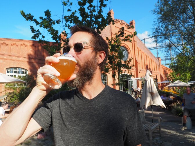 Stone Brewing co-founder and chairman Greg Koch gulps down a beer.