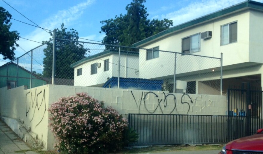 This wall on a street corner is tagged with large "V-C-Y-S" letters that, according to police, indicate it's "Crazys" gang territory.