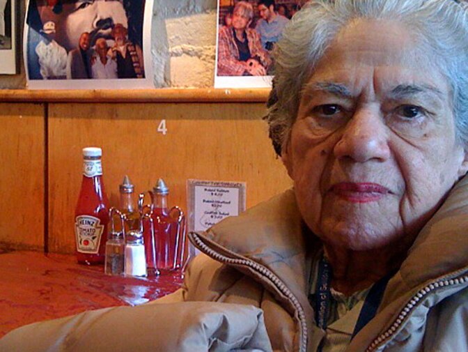 At a New York cafe, 82-year-old Antonia Andujar says she likes her Puerto Rican birth certificate and has no intention of getting a new one.