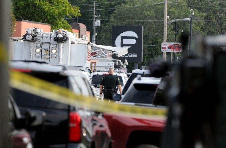 ORLANDO, FL - JUNE 12:  Orlando police officers seen outside of Pulse nightclub after a fatal shooting and hostage situation on June 12, 2016 in Orlando, Florida. The suspect was shot and killed by police after 20 people died and 42 were injured. (Photo by Gerardo Mora/Getty Images)