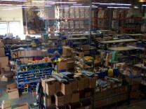 The Federal Reserve Friday said U.S. factories barely increased their output in May after two months of declines, a sign that manufacturing is providing little support for the economy. Factories produced more autos, computers and wood products last month, offsetting declines in the production of primary metals such as steel and furniture. (Photo: A wide view of the AirSplat warehouse in Calif.)