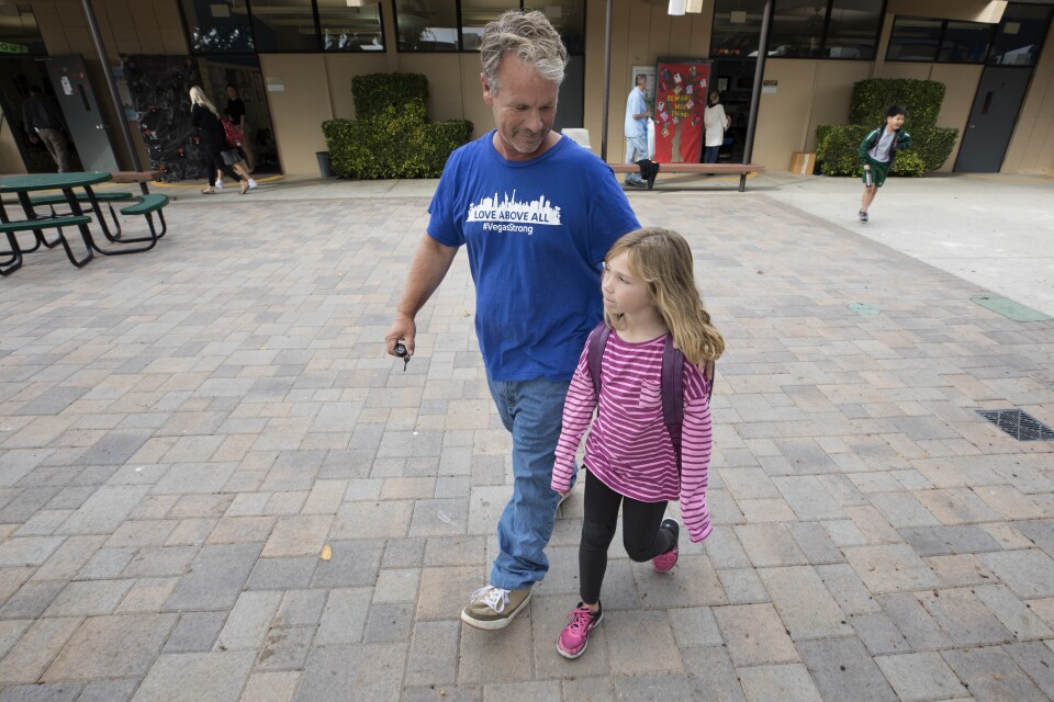 Bob Patterson picks up his daughter from school in Lomita, Calif. on Oct. 30, 2017.