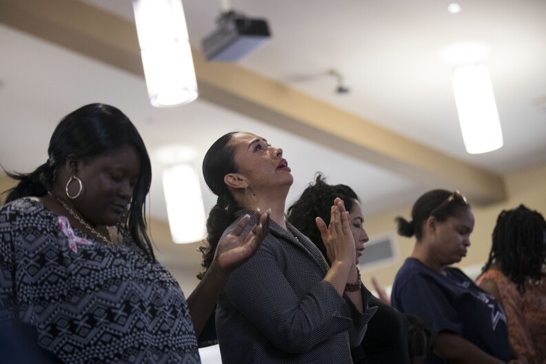 LAS VEGAS, NV - OCTOBER 8: Worshippers pray during a special 'Healing Through Celebration' afternoon service at First African Methodist Episcopal Church Las Vegas, on October 8, 2017 in North Las Vegas, Nevada. On October 1, Stephen Paddock killed at least 58 people and injured more than 450 after he opened fire on a large crowd at the Route 91 Harvest country music festival. The massacre is one of the deadliest mass shooting events in U.S. history. (Photo by Drew Angerer/Getty Images)