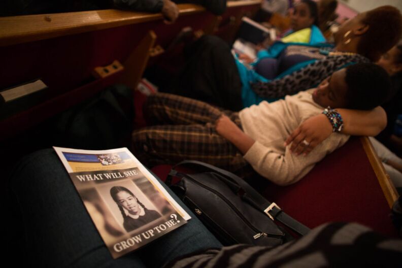 A pamphlet for Mayoral Candidate Jan Perry sits on the lap of an audience member at Mount Gilead Baptist Church in South Los Angles.