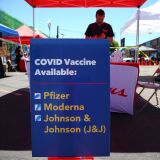 LOS ANGELES, CALIFORNIA - JUNE 25: A sign displays the types of COVID-19 vaccination doses available at a Walgreens mobile bus clinic on June 25, 2021 in Los Angeles, California. The United States will miss President Joe Biden's goal of delivering at least one coronavirus vaccine dose to 70 percent of adults by the July 4th holiday. (Photo by Mario Tama/Getty Images)